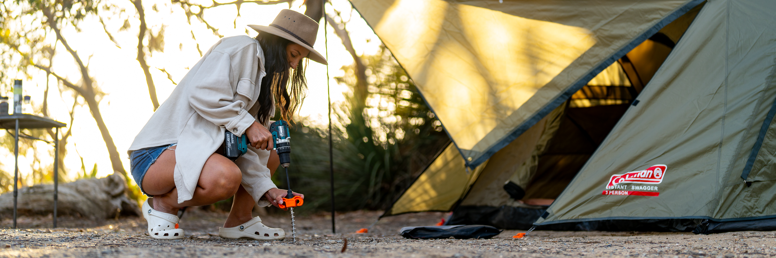 Drilling peg into hard ground at campsite setting up tent | Tiegear Terra Pegs | Screw in Pegs | Camping Pegs | Camping Accessories