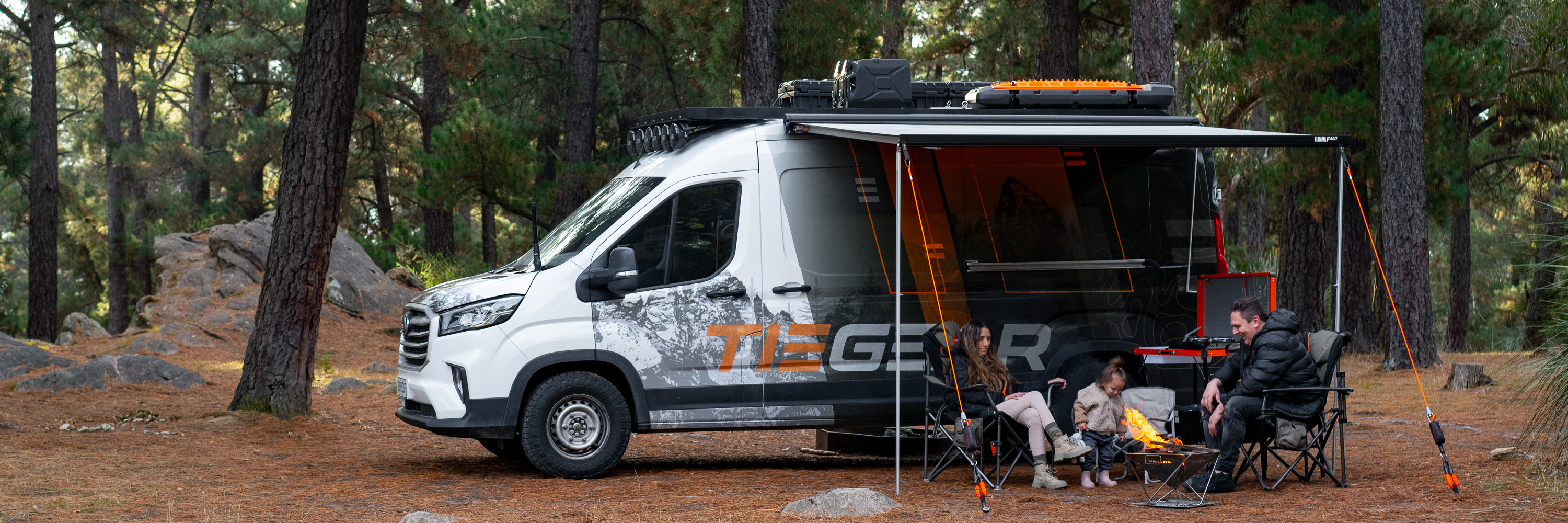 Sitting around the fire in the forrest camping with the family | Van camping | Camping Accessories | Tiegear Guy Rope | Screw in Pegs 