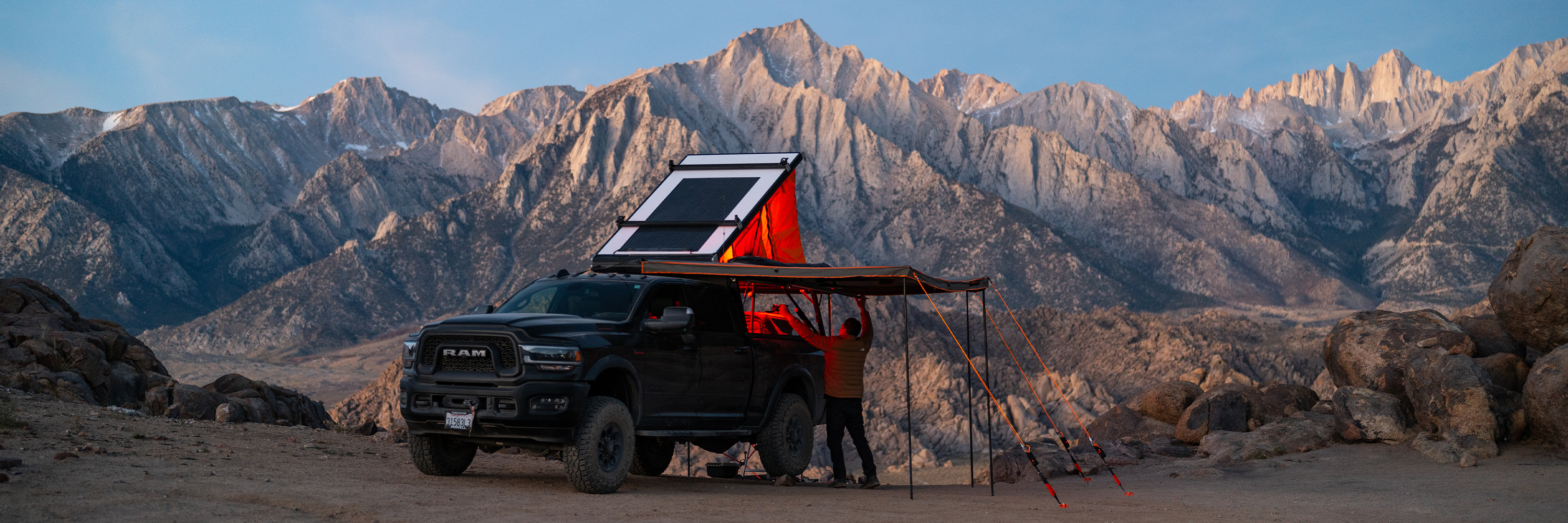 Getting gear out the truck bed while protected by the 270 awning anchored down with tie downs | 270 awning accessories | Camping Accessories | Camping | Tiegear Guy Rope